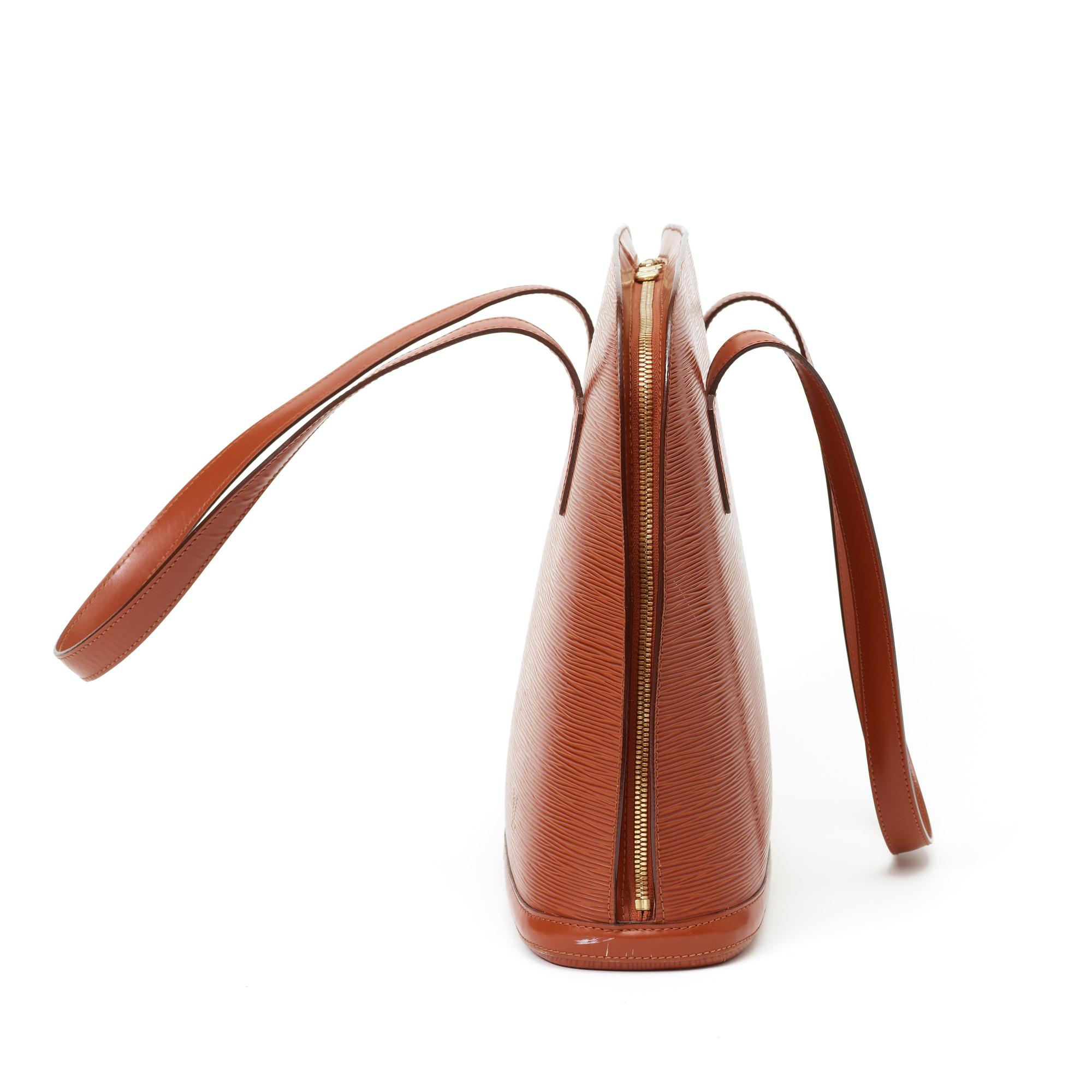 A 1999 terracotta epi leather handbag by Louis Vuitton.