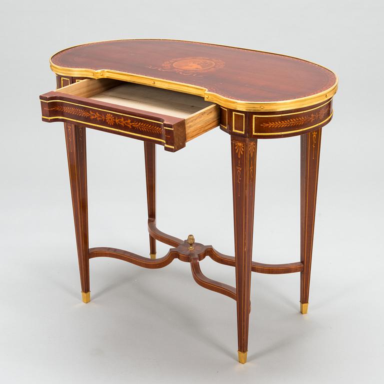 A Directoire style marquetry table from around year 1900.