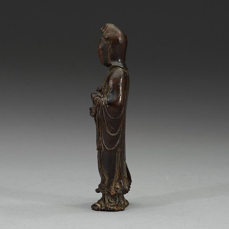 A bronze standing Guanyin holding a ruyi-scepter, Qing dynasty, 18th century.
