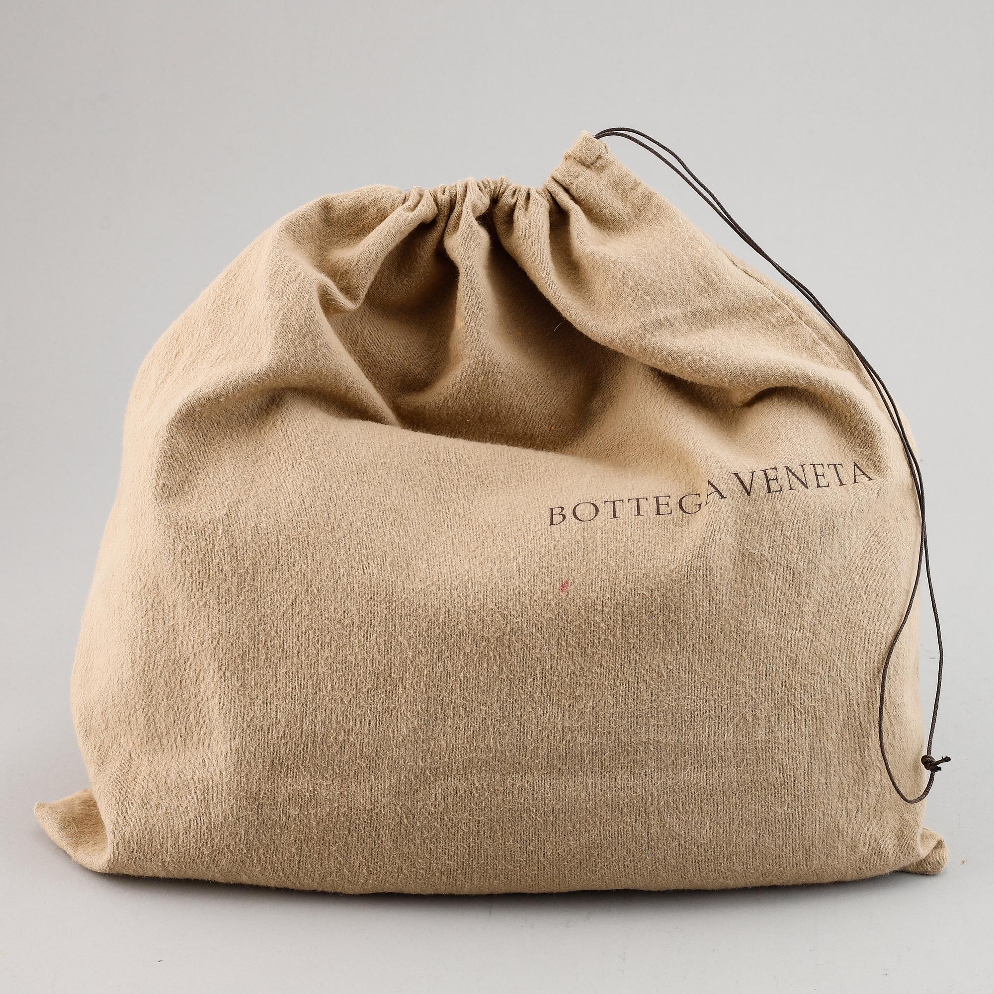 Bottega Veneta, a black leather bag.