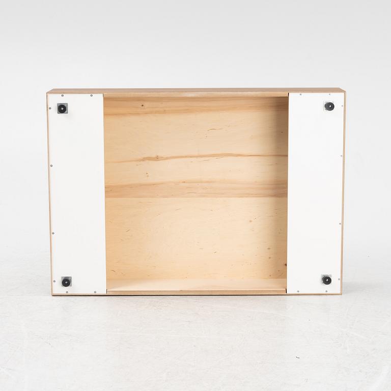 A 'Mass Wide' walnut veneered coffee table from New Works.