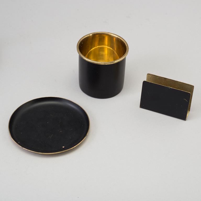 GUNNAR ANDER, a brass and iron table from Ystad-Metall, mid 20th Century.