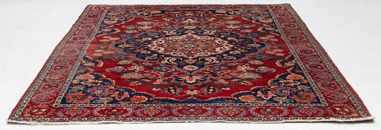 An Persian carpet, ca. 310 x 215 cm.