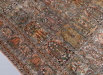 A Kashmir silk carpet, 418 x 297 cm.