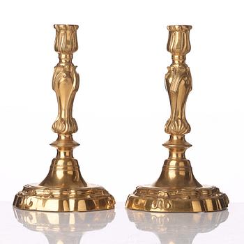 A pair of French Louis XV 18th century gilt bronze candlesticks.