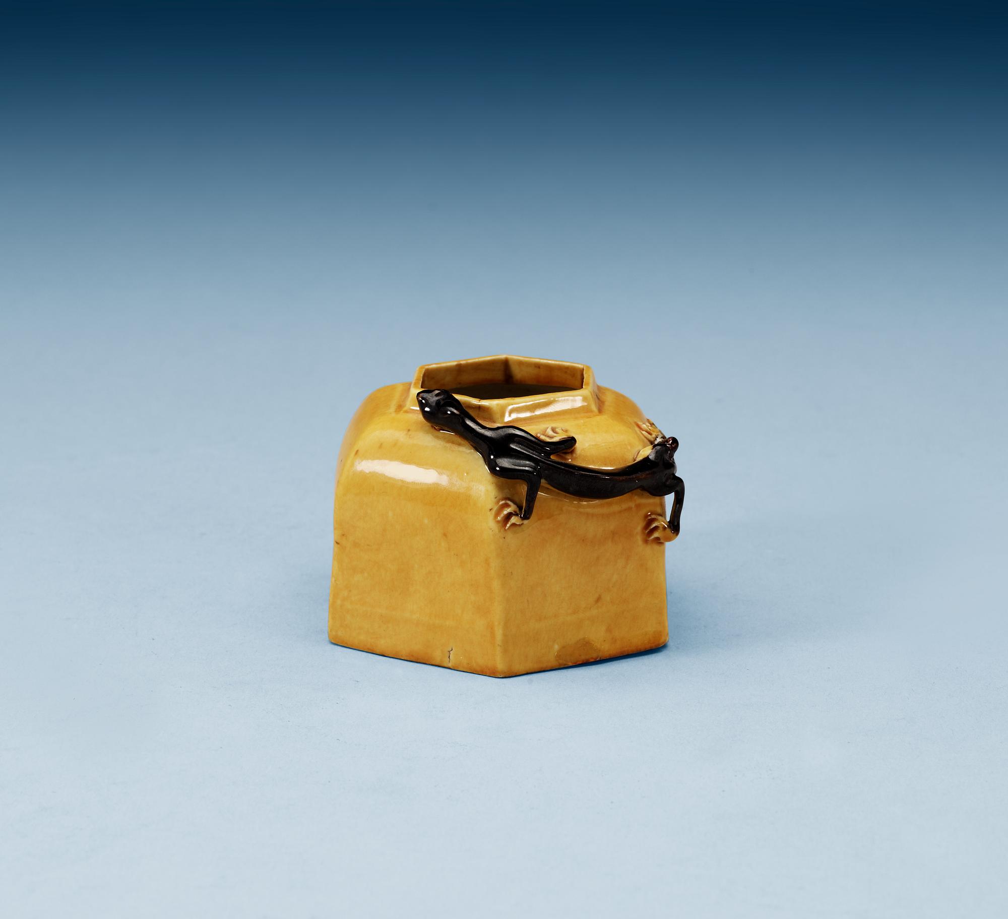 A yellow and brown glazed brush washer with curling dragon, Qing dynasty, 19th Century, with Xuande four character mark.