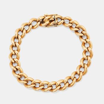 An 18K gold bracelet.