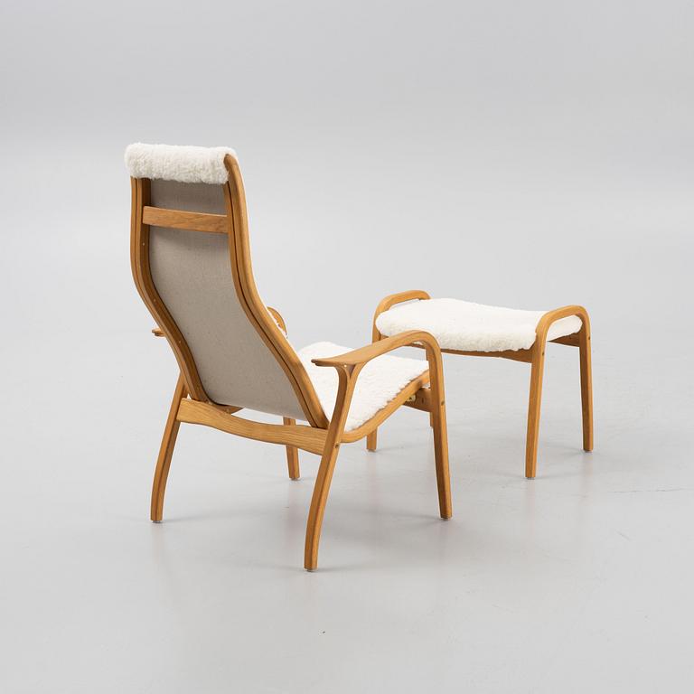 Yngve Ekström, a 'Lamino' armchair and a foot stool, Swedese.