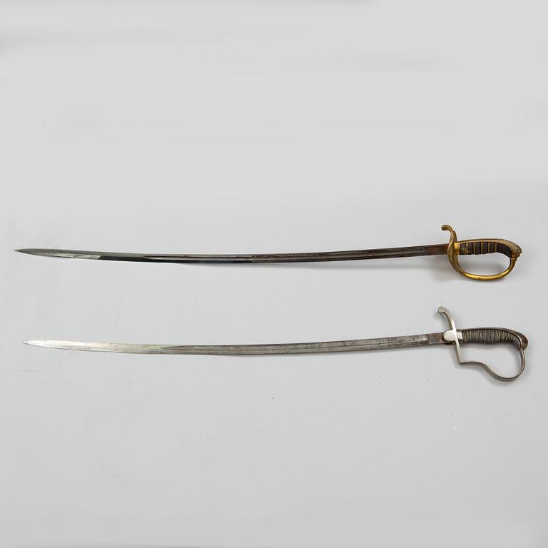 Two Swedish sabres, end of the 19th Century, with scabbards.