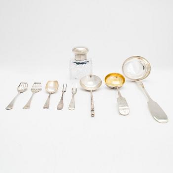 A silver and glass inkwell and eight pieces of silver cutlery, Latvia and Estonia, mid-19th century and 1924-44.