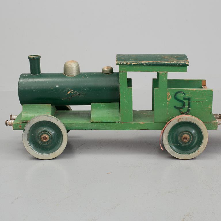 A set of four pieces wooden toy train.