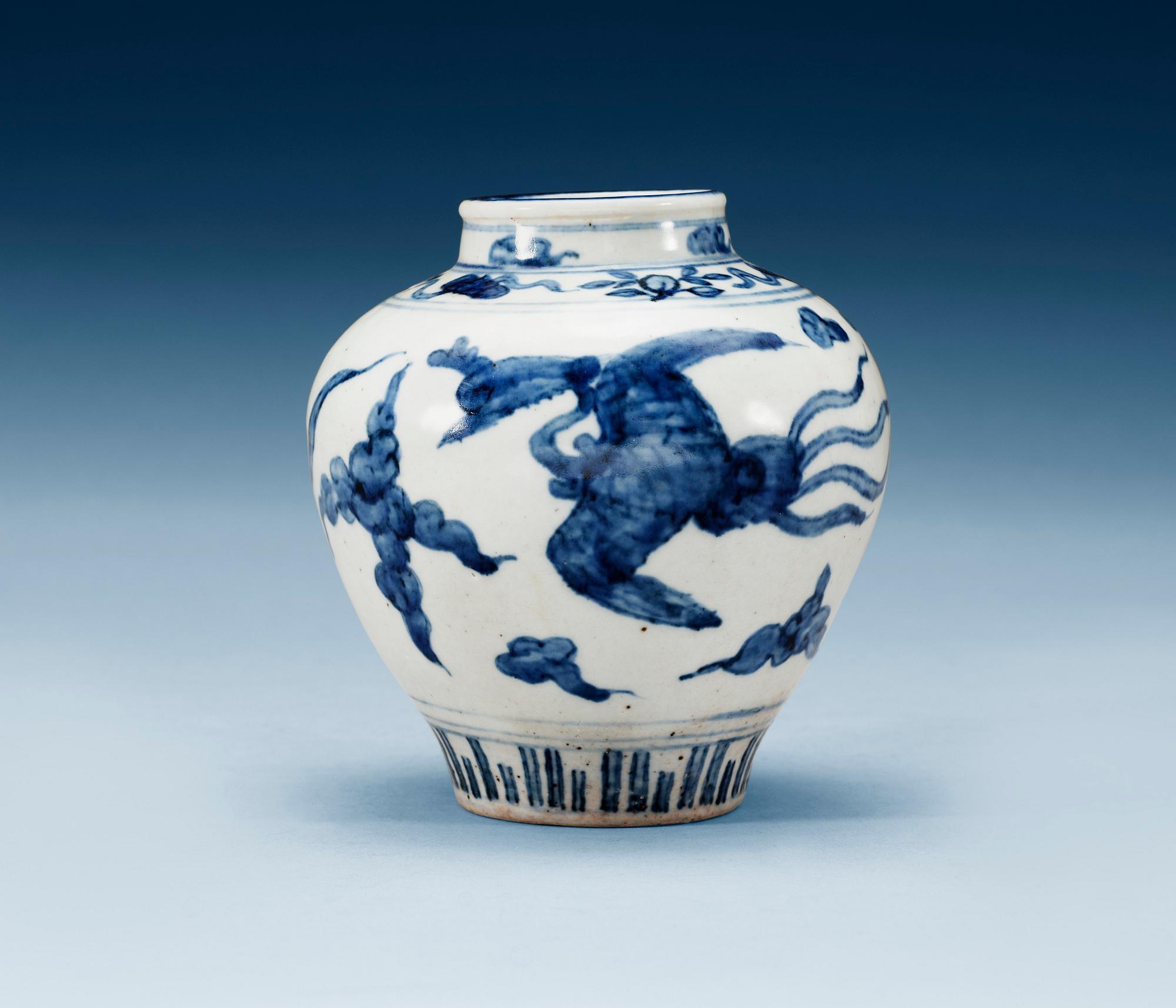 A blue and white jar with flying phoenix birds among clouds, Ming dynasty, 16th century.