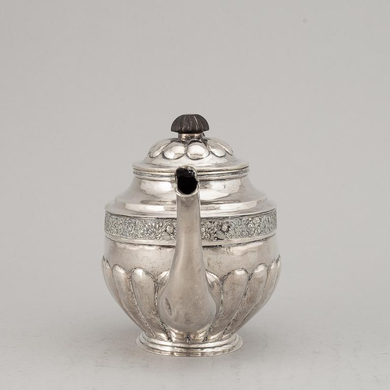 A Russian 19th century parcel-gilt silver tea-pot, marked Moscow 1833.