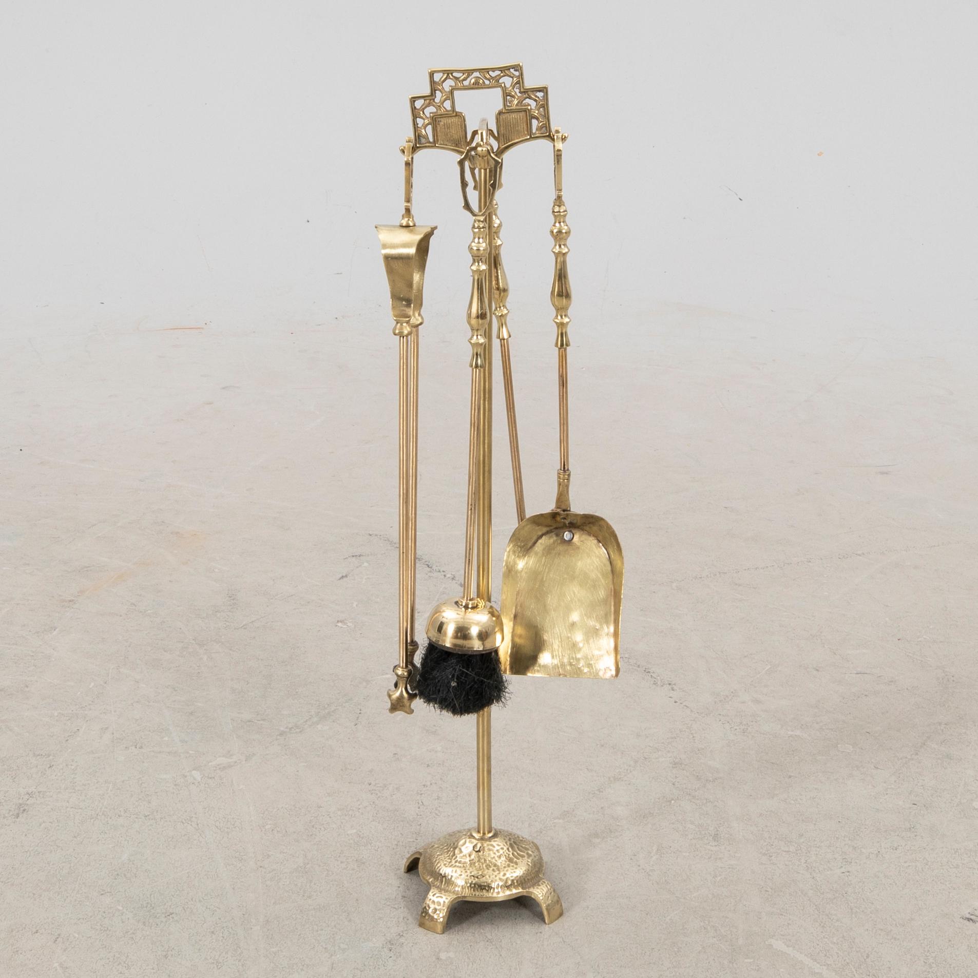 A late 20th century English brass fire tools.