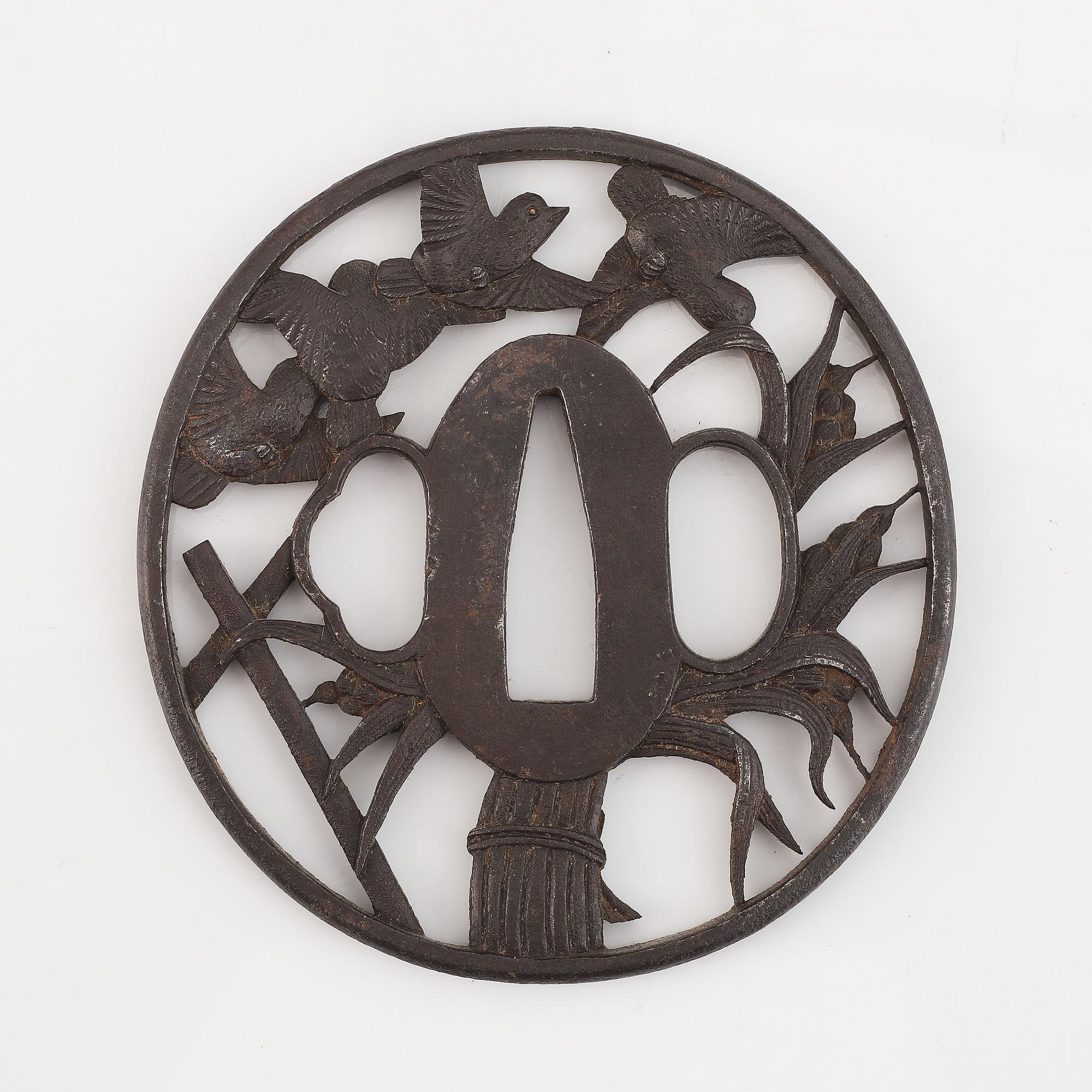 Three Japanese iron Tsubas, late Edo, one signed Kunihiro.