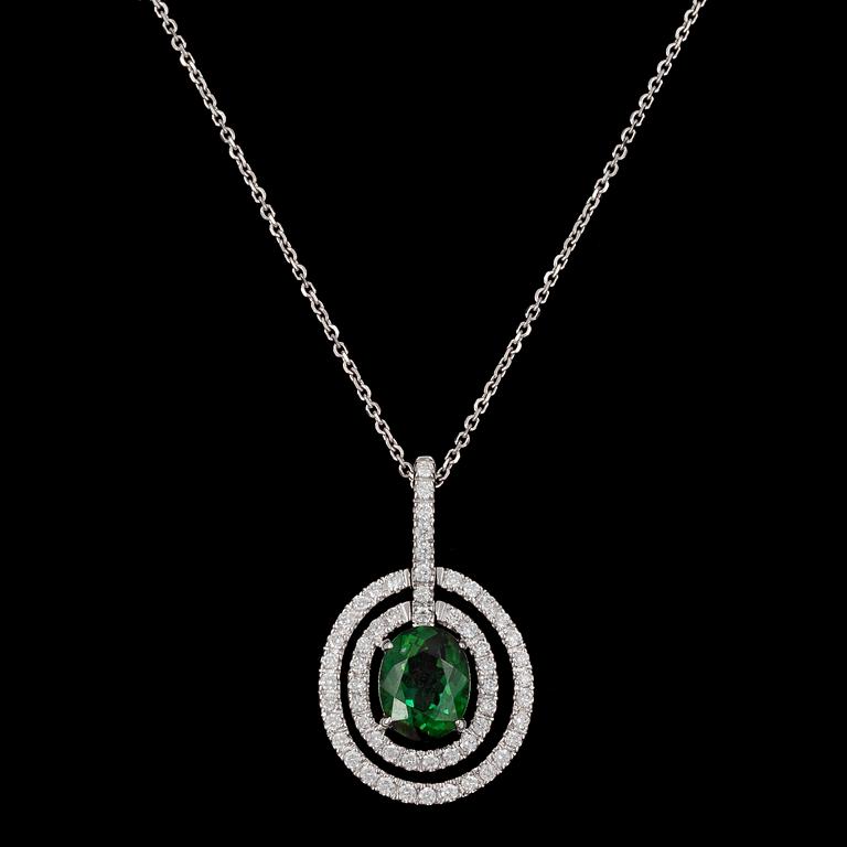 PENDANT, oval cut green tourmaline and brilliant cut diamonds, tot. 0.53 cts.
