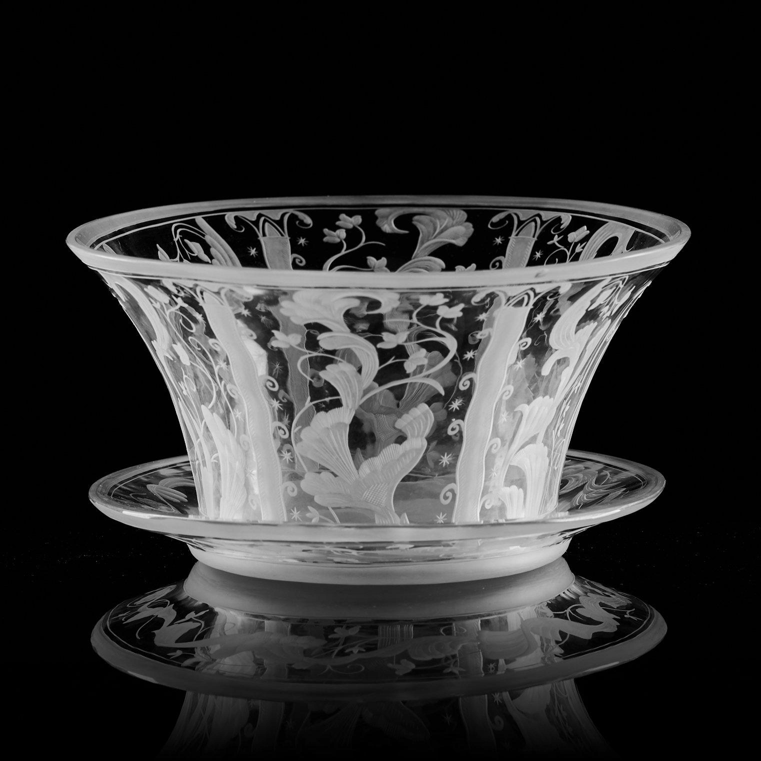 Simon Gate, a Swedish Grace engraved glass bowl with stand, Orrefors 1930, model 147, engraved by Karl Rössler.