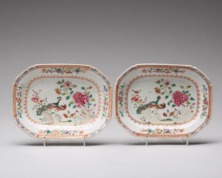 A pair of famille rose 'double peacock' butter tureens with cover and stand, Qing dynasty, Qianlong (1736-95).