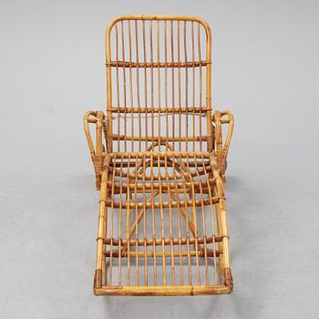 A rattan lounge chair.