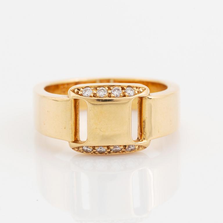 Hermès 18K gold ring set with round and brilliant-cut diamonds.