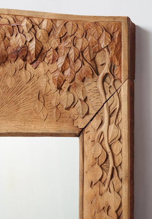 A Swedish Art Nouveau/ Folk art carved mirror, early 20th century.