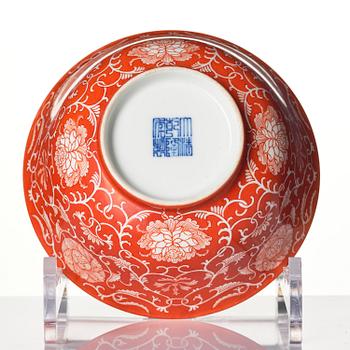 A coral red reserve decorated floral bowl, Qing dynasty with Qianlong mark.
