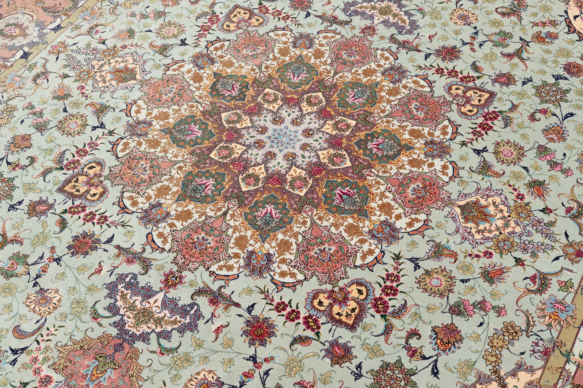 A Tabriz carpet, part silk, approx. 367 x 250 cm.