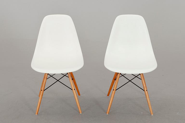 A PAIR OF "PLASTIC CHAIR" BY CHARLES & RAY EAMES, Vitra 2009.