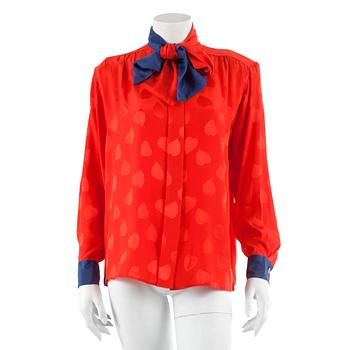 782. YVES SAINT LAURENT, a red silk blouse, size 40.