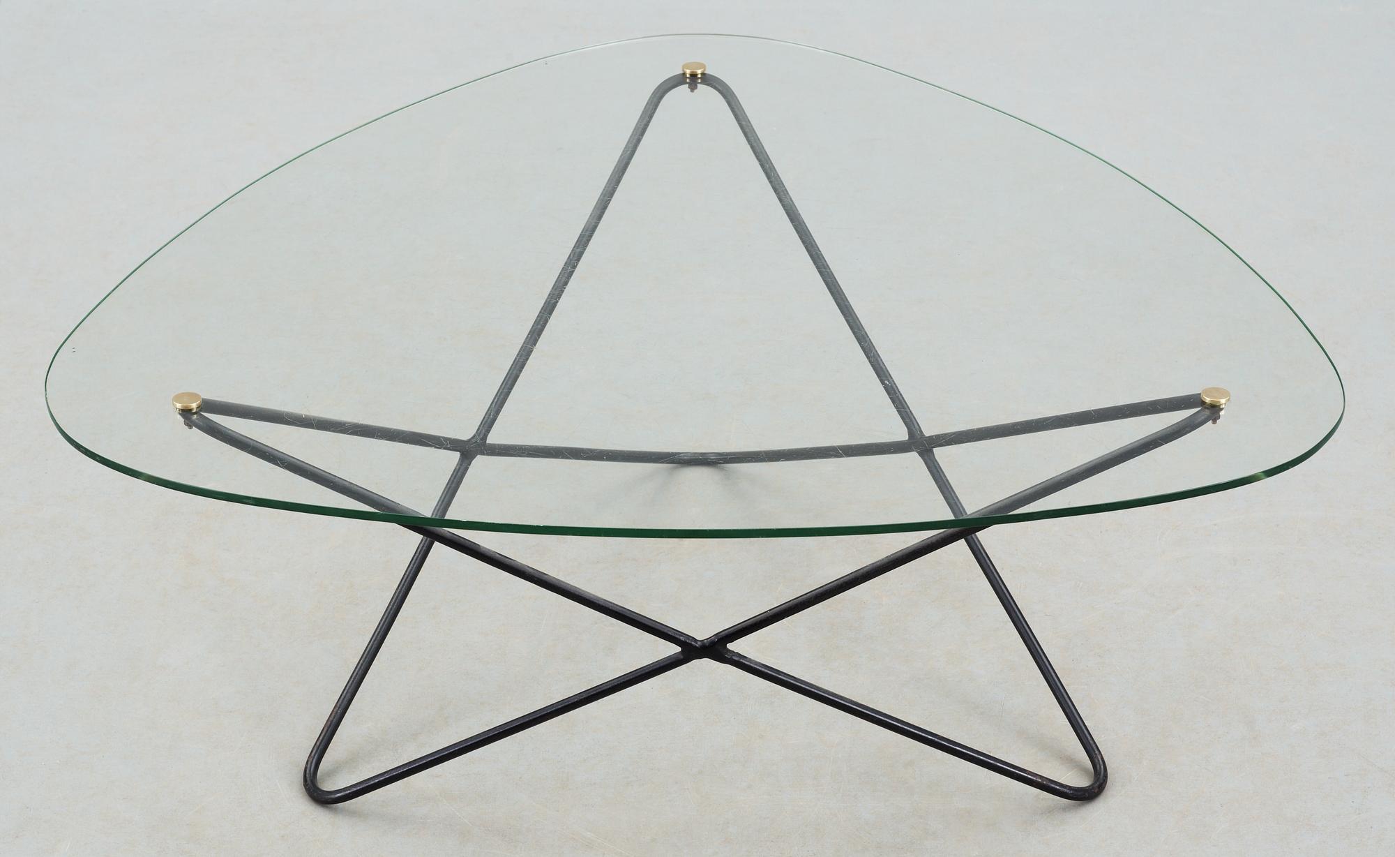 A Jacques Tournus glass and metal sofa table by Airborne.