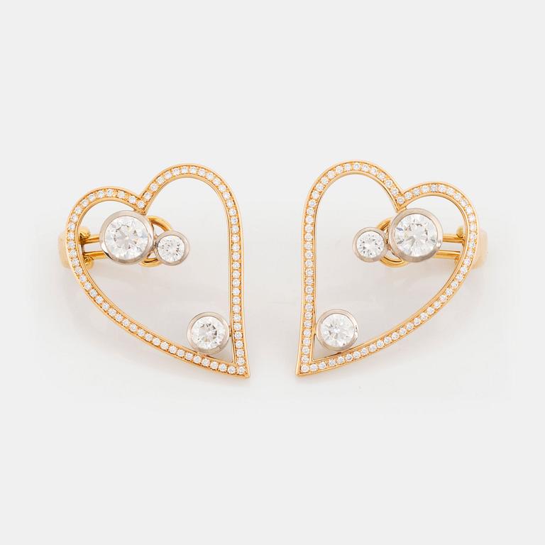 WA Bolin a pair of earrings in 18K gold and white gold set with round brilliant-cut diamonds.