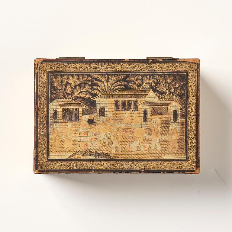 A lacquer tea box and a blanc de chine cup, Qing dynasty 18/19th century.