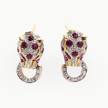 A pair of 18K gold earrings with rubies and diamonds.