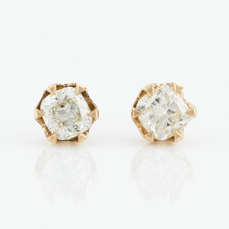 Earrings with cushion-cut diamonds.