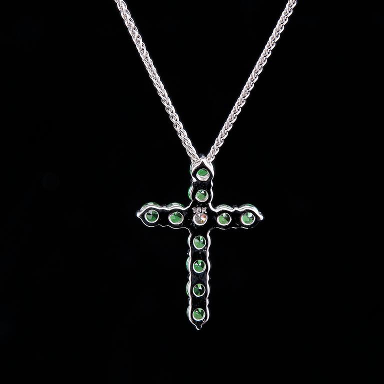 A CROSS PENDANT, 12 tsavorites 0.75 ct, 1 brilliant cut diamond 0,12 ct. VS.