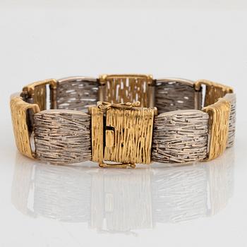 An 18K gold and white gold bracelet.