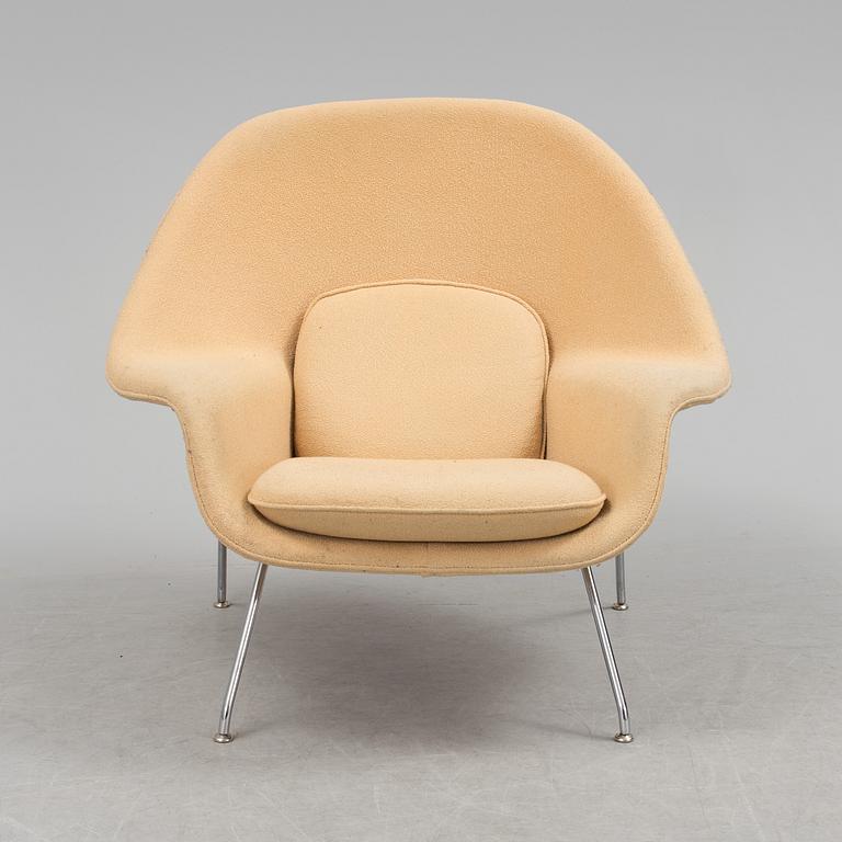 EERO SAARINEN, a "Womb chair" by knoll international.