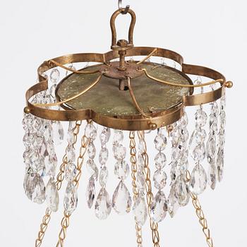 A late Gustavian gilt-brass and green glass six-light chandelier, late 18th century.