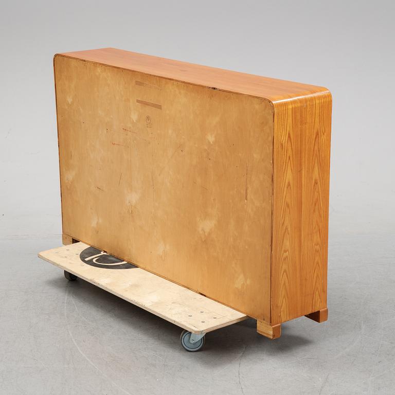 A mid 20th Century elm wood book case.