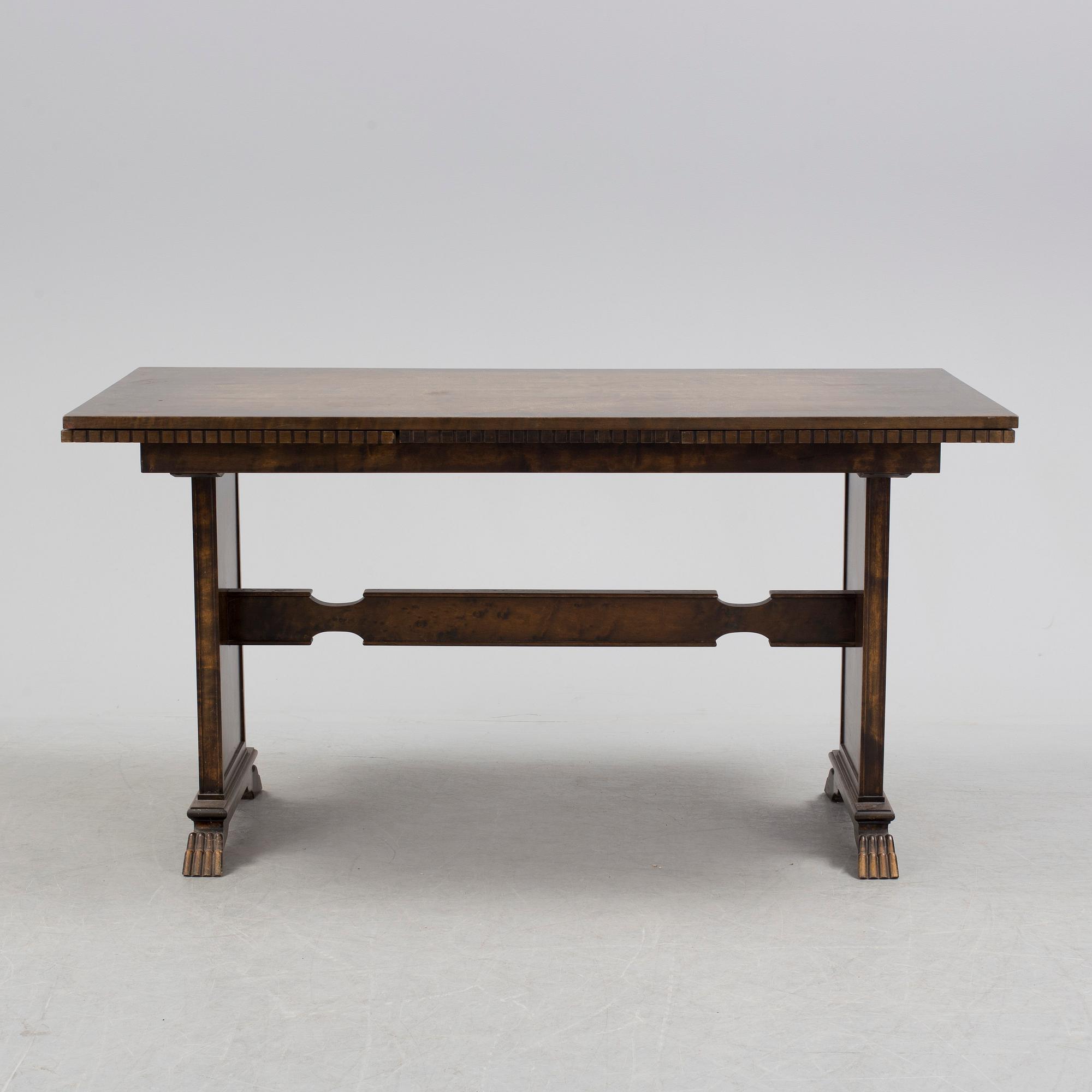 A 1920´s dinner table and six chairs probably designed by Axel Einar Hjorth for AB Svenska möbelfabriken Bodafors.
