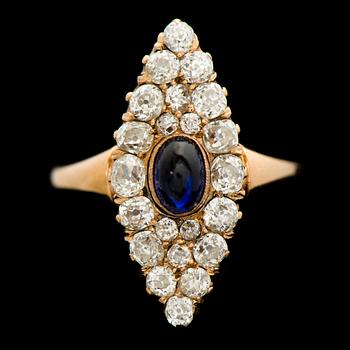 A RING, cabochon cut sapphire, old cut diamonds, 14K (56) gold. Russia.