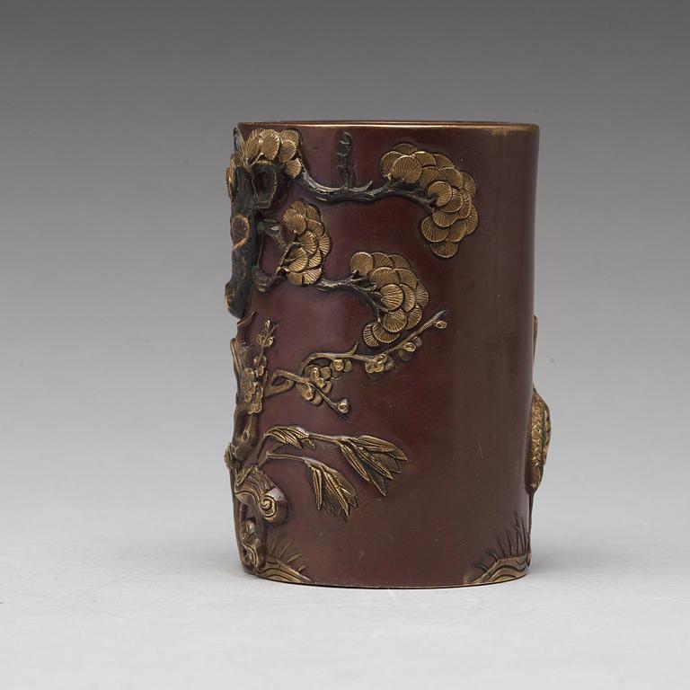 A bronze brush pot, Qing dynasty, with Qianlong seal mark to base.