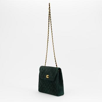 Chanel, a green suede bag with pouch, 1989-1991.