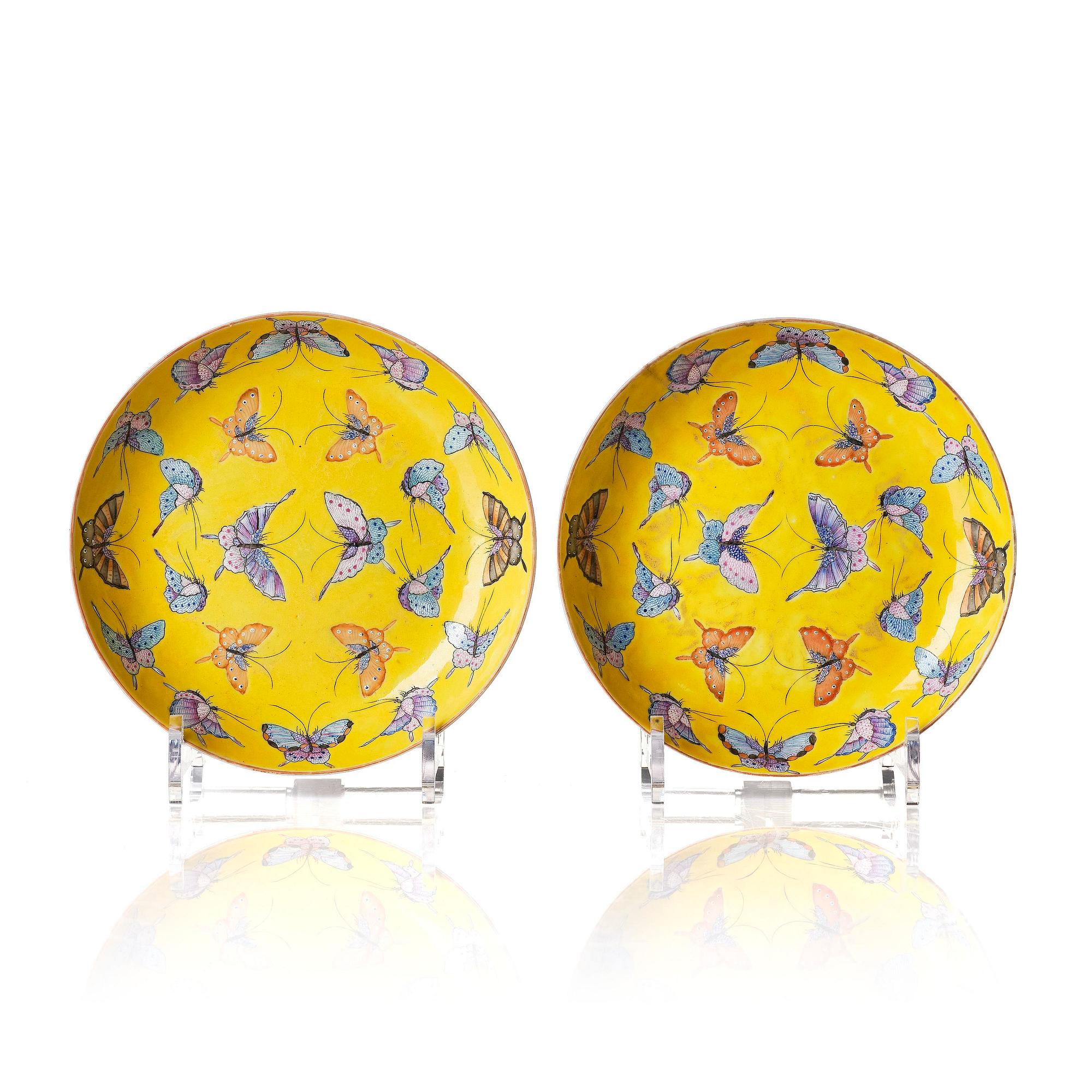 A pair of yellow ground 'butterfly' dishes, late Qing dynasty with Tongzhi mark in red.