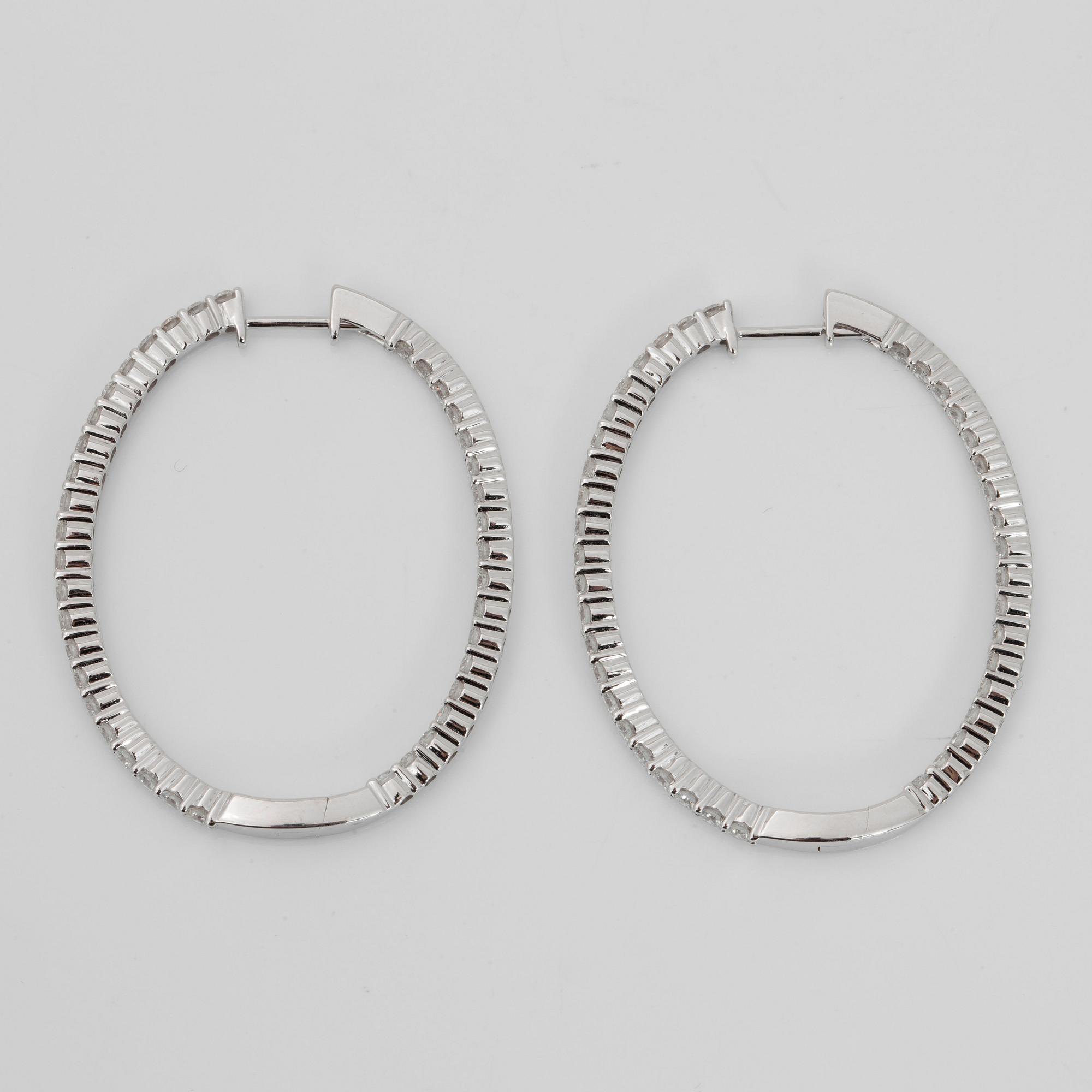 A pair of brilliant-cut diamond earrings. Total carat weight circa 2.30 cts.
