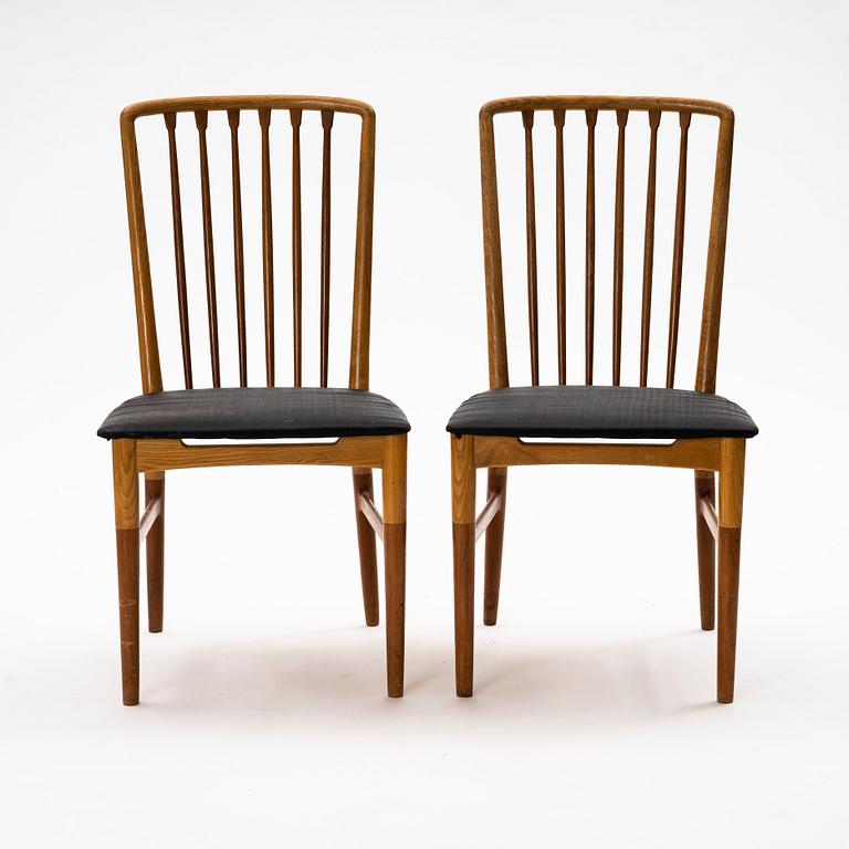 A pair of Scandinavian Mid Century Modern teak, oak and elm chairs.