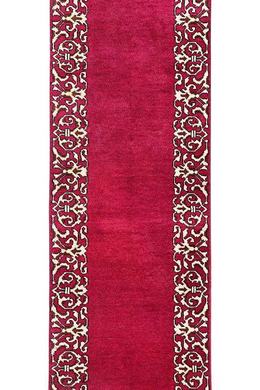 A Persian runner carpet, c. 490 x 67 cm.