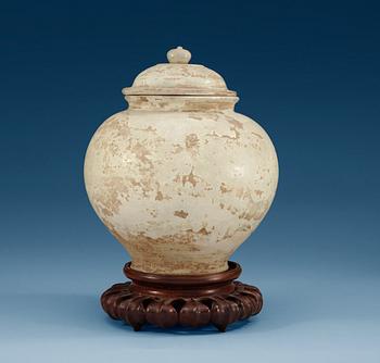 A cream glazed potted jar, Tang dynasty (618-907 AD.).
