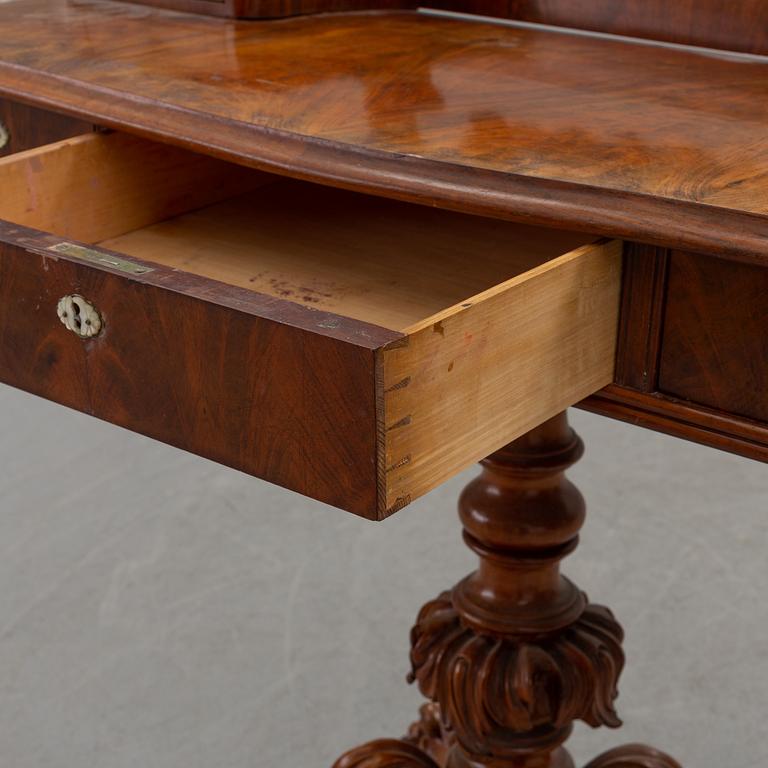 An end of the 19th century Rococo style table with mirror.