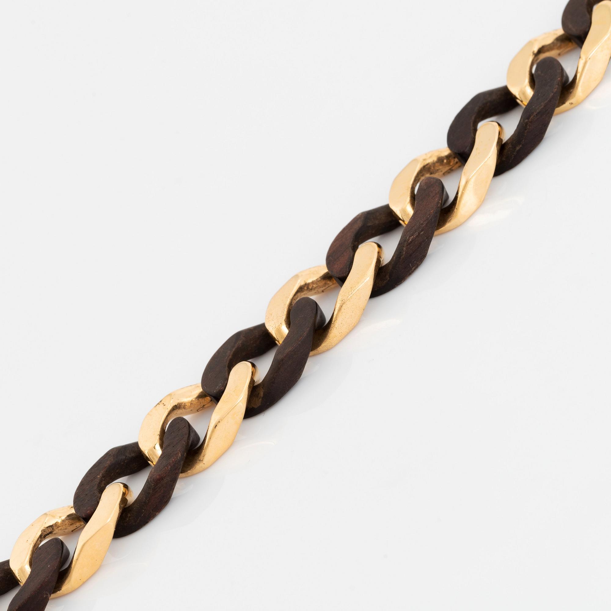 A Van Cleef & Arpels 18K gold and wood bracelet.